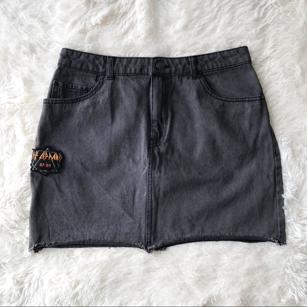 Junkfood  faded black denim mini jean skirt with Def Lepard band patches…